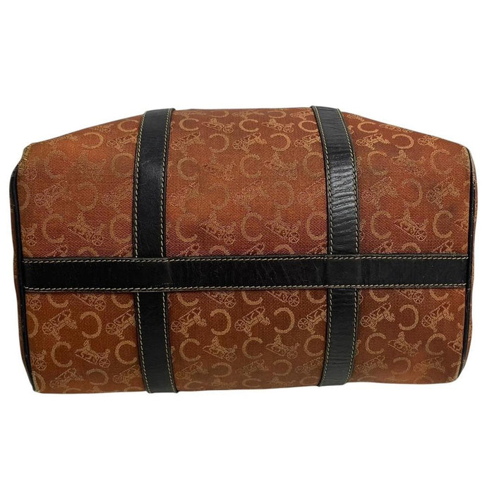 CELINE orange duffel bag with Macadam canvas and leather, visible wear and discolouration.