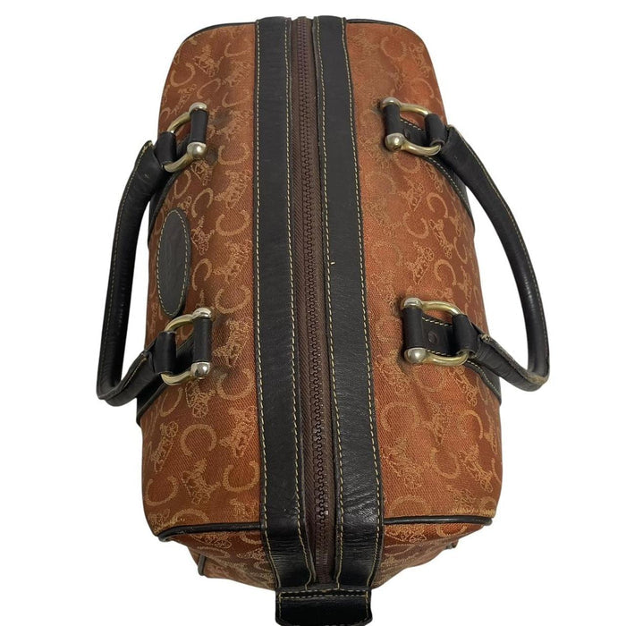 CELINE orange duffel bag with Macadam canvas and leather, visible wear and discolouration.
