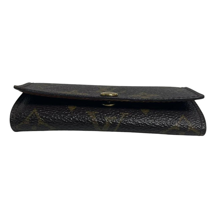 Louis Vuitton brown and tan monogram canvas key case with logo detail.