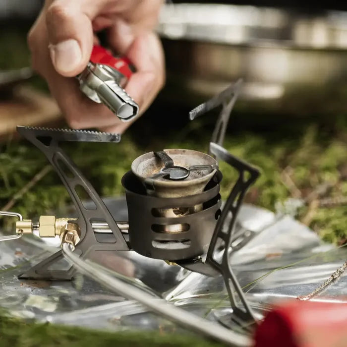 Red Power Lighter being used to light a camping gas stove outdoors