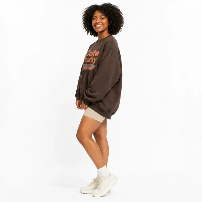 Coffee Brown printed sweatshirt for women in side view showing the relaxed oversized silhouette.