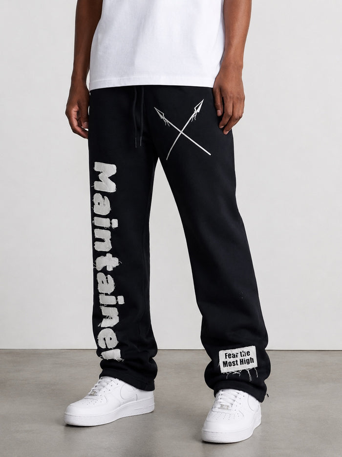 Black Protector and Maintainer FTMH heavyweight stacked sweatpants laid flat showing the relaxed fit and soft fabric.