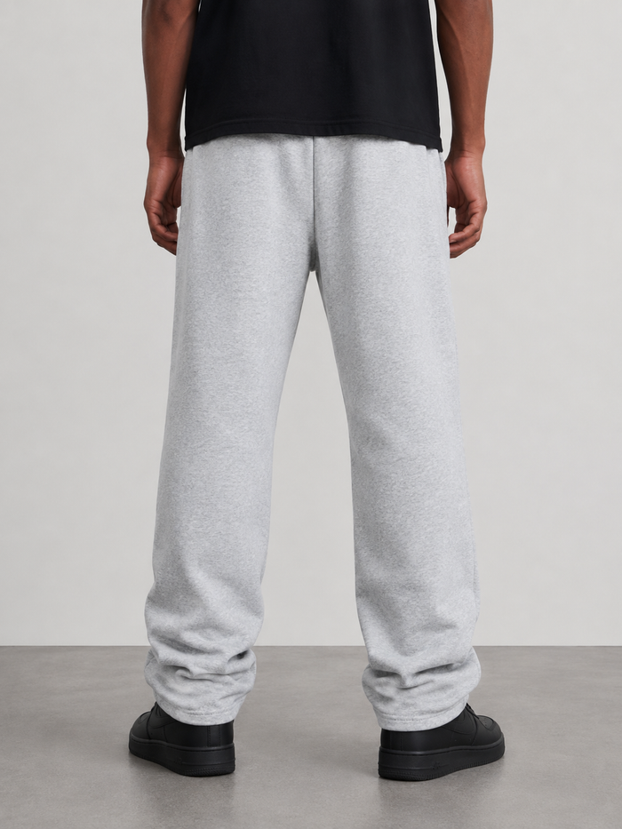 Grey Protector and Maintainer FTMH heavyweight stacked sweatpants, showing the relaxed fit and soft fabric texture.