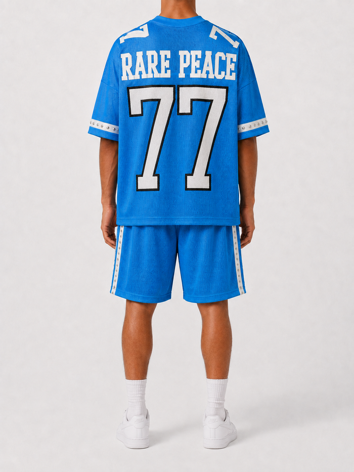 Rare Peace blue rhinestone mesh shorts with bold eye design, stylish and eye-catching for casual or party wear.