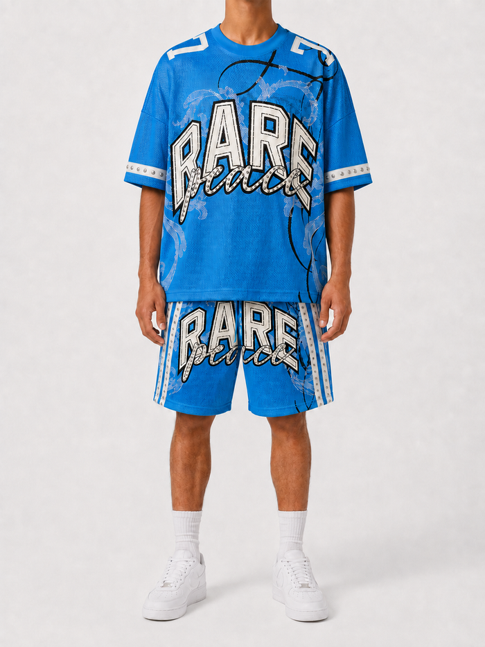 Rare Peace Big Eye rhinestone mesh top in C. Blue, oversized boxy fit jersey with eye-catching embellishments.