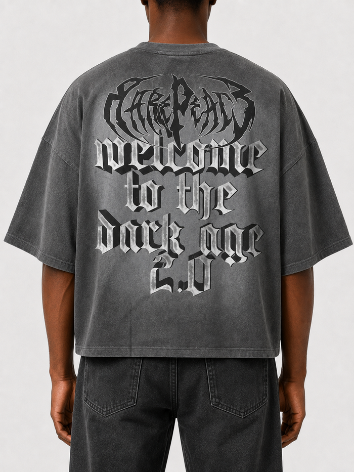 Grey oversized rhinestone T-shirt from RARE PEACE with "Trust No One" text, cropped fit and bold, eye-catching design.