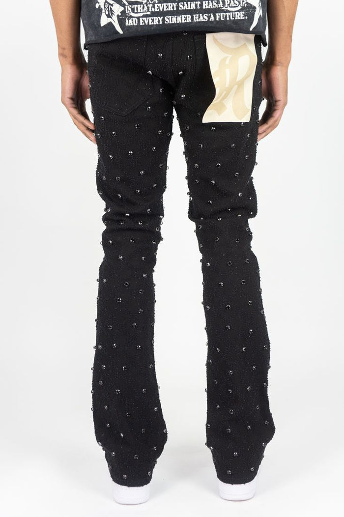 Black Rebel Denim Diamond Stacked Flare Jeans, stacked denim style with flared cut, showcased on a model.