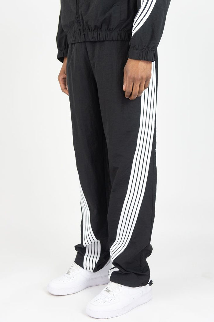 Rebel Minds black nylon sweatpants with bent stripe design, comfortable fit, and athletic style.