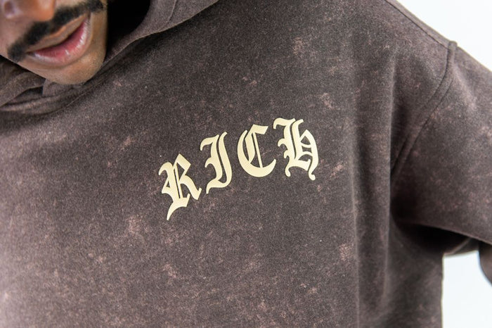 Rust-colored Rebel Minds Cash Flow hoodie, unisex hoodie with front graphic and soft fabric, casual streetwear style.