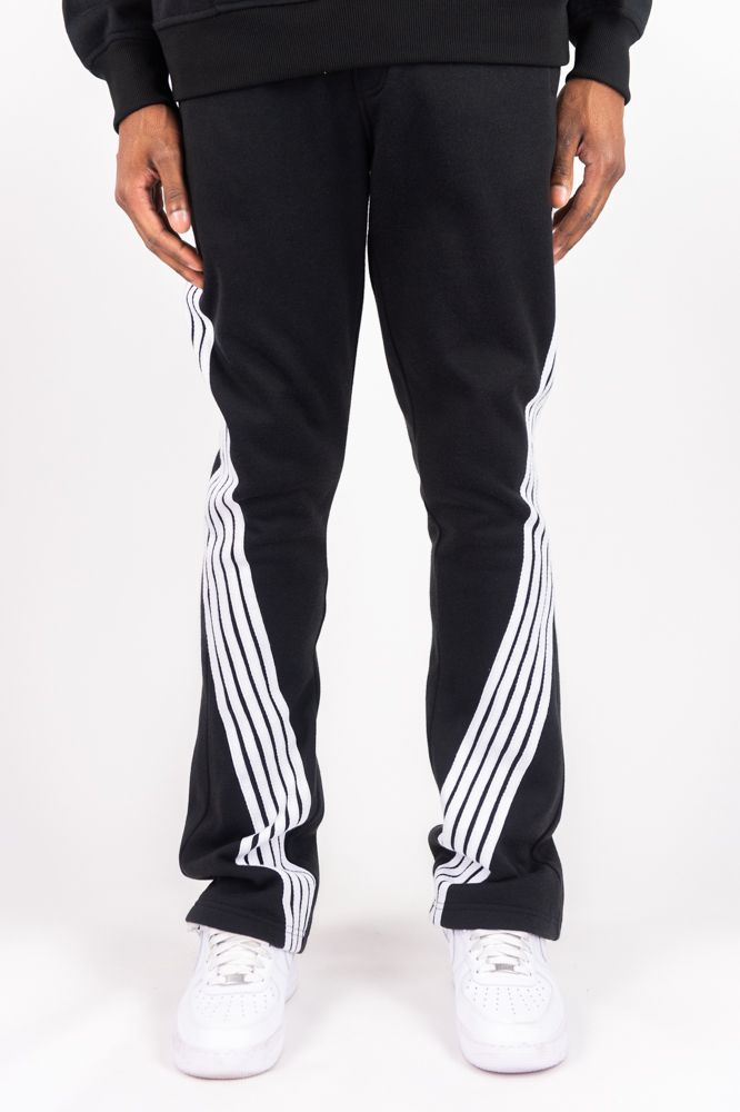 Rebel Minds Five Stripes black and white stacked sweatpants with bold stripe details, made from comfortable cotton fabric.