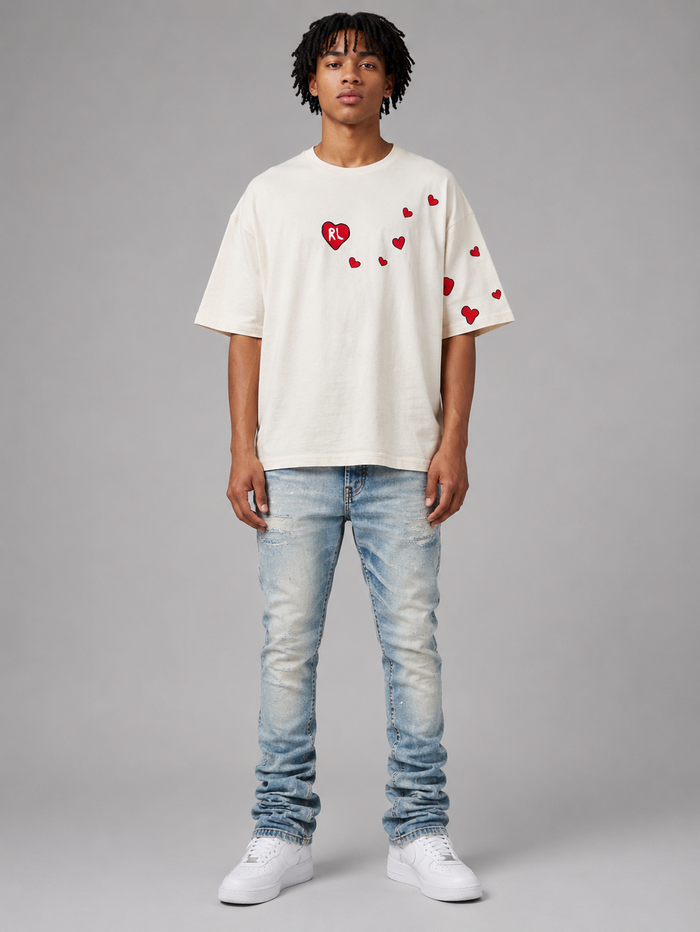 Red Letters "Love Letters" oversized cream T-shirt with bold red lettering, casual fit, and soft fabric.