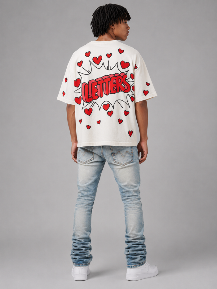 Red Letters "Love Letters" oversized cream T-shirt with bold red text, casual fit, and soft fabric.