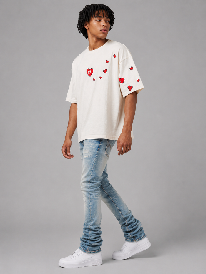 Red Letters Love Letters oversized T-shirt in cream color with bold red lettering and relaxed fit, casual streetwear style.