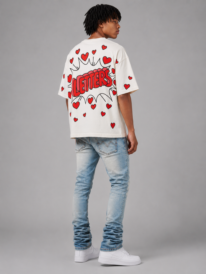 Red Letters "Love Letters" oversized cream T-shirt with bold red text, casual fit, and soft fabric.