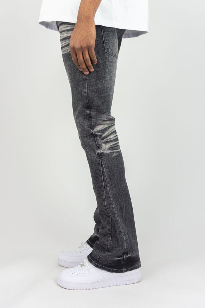 Roar Denim 'Basic' stacked flare jeans in grey sand, showcasing the denim's textured fabric and stylish stacked design.