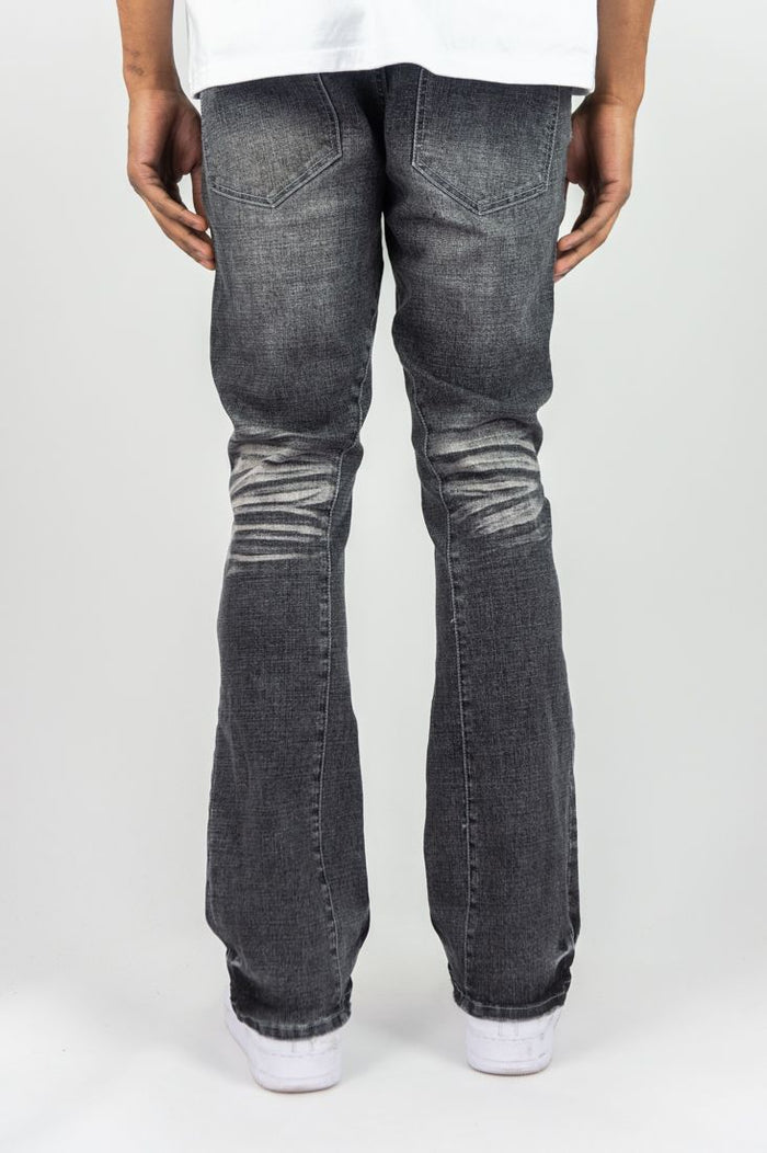 Roar Denim stacked flare jeans in grey sand with a high waist and distressed detailing, showcasing the stylish stacked denim design.