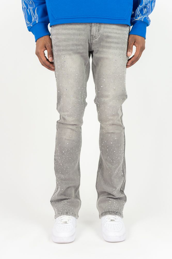 Roar Denim stacked flare jeans in grey with rhinestone embellishments, featuring a fitted waistband and flared leg design.