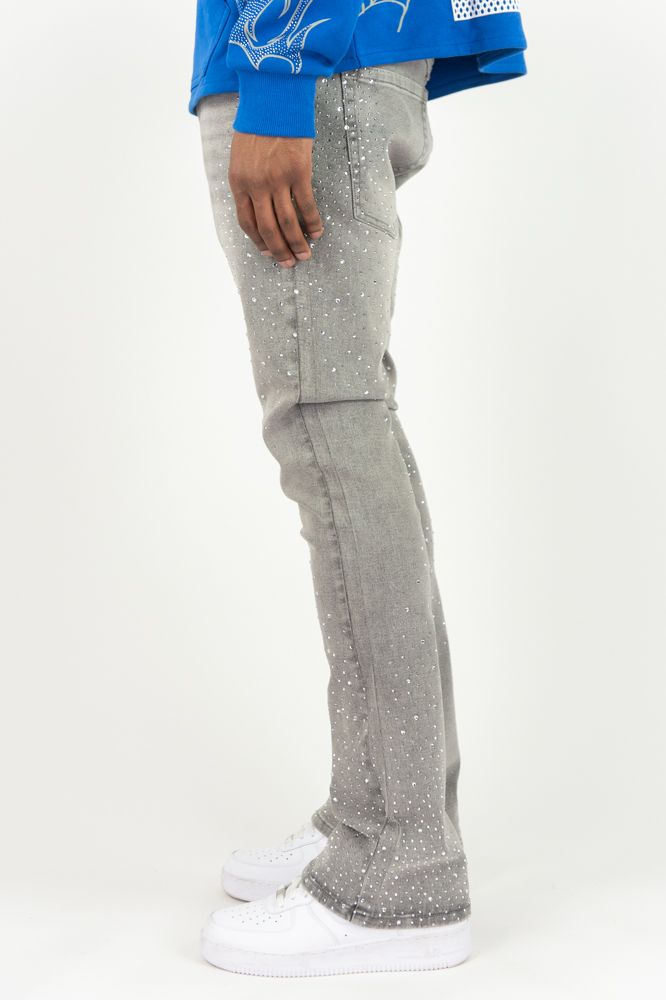 Gray Roar Denim stacked flare jeans with rhinestone embellishments, featuring a stylish, fitted waist and flared leg design.