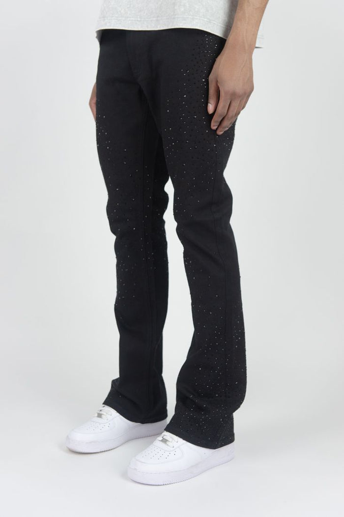 Roar Denim stacked flare denim jeans in jet black with rhinestone embellishments, featuring a high-rise, fitting silhouette.