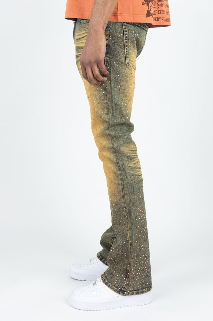 Rust-colored Roar Denim Rhinestone Stacked Flare Denim jeans with a fitted waist and flared legs, featuring rhinestone embellishments.