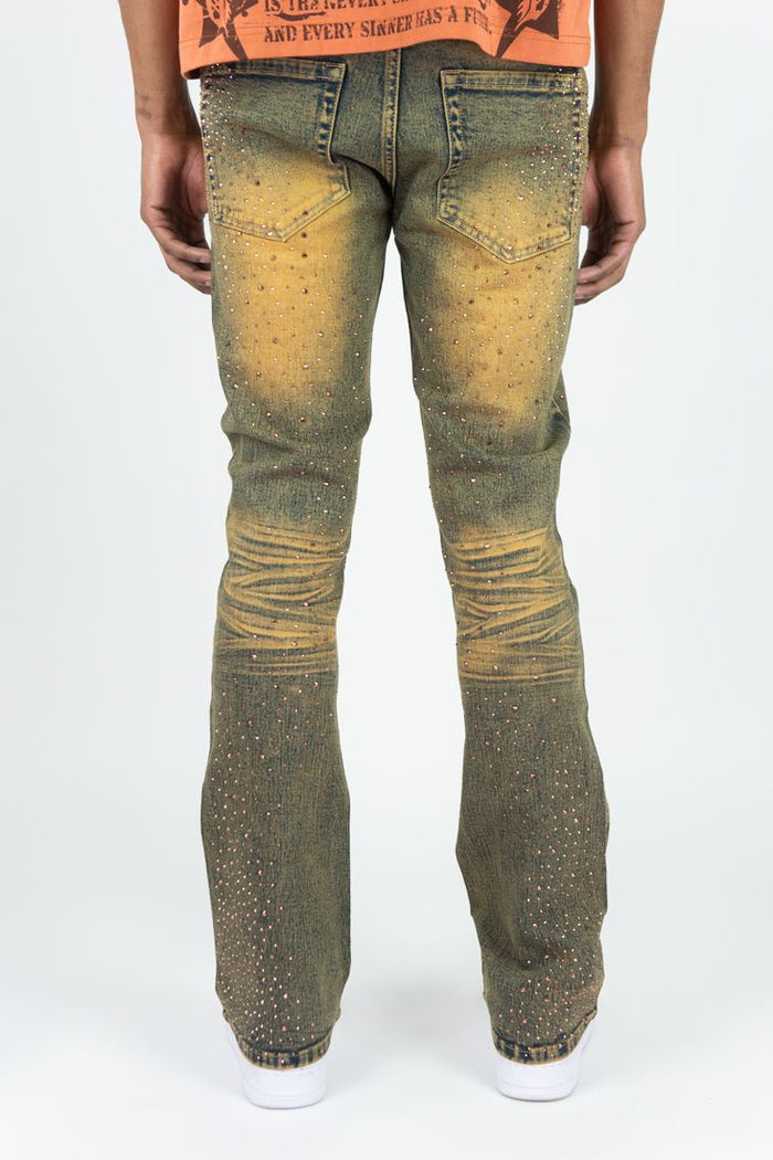 Roar Denim Rhinestone Stacked Flare Denim in rust color, featuring a stylish stacked flare design and rhinestone embellishments.