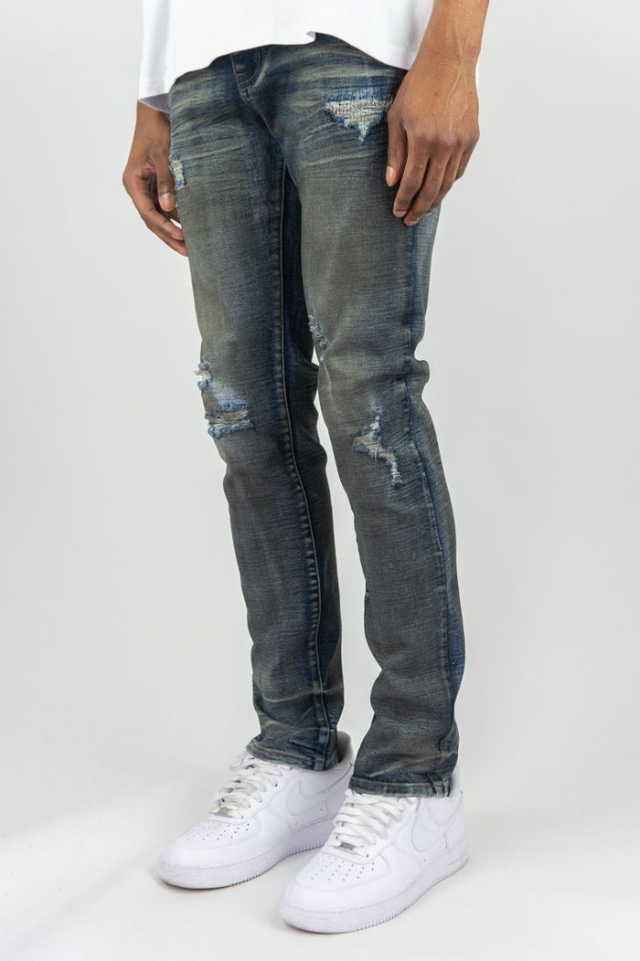 Dark vintage slim straight denim jeans by Roar Denim, featuring classic five-pocket design and subtle fading.
