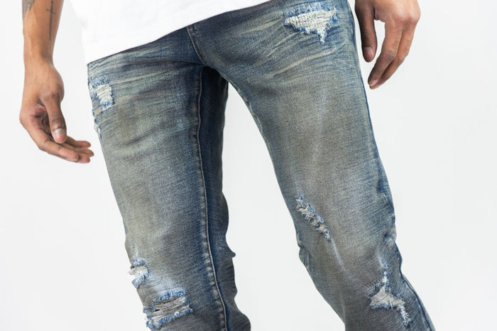 Dark vintage Roar Denim R&R slim straight denim jeans displayed on a model, showcasing classic fit and dark wash.