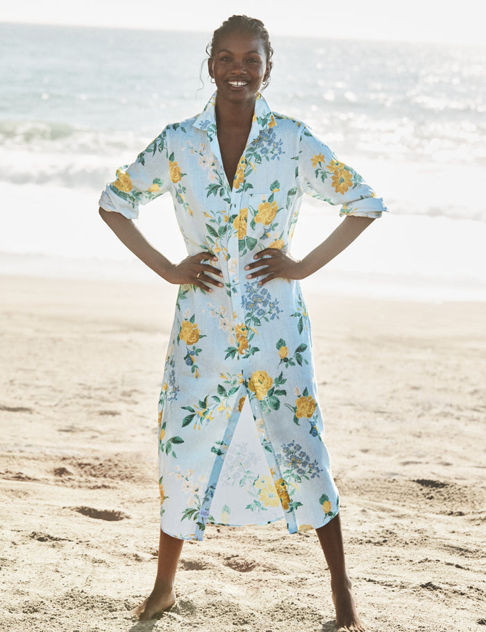 Woman wearing a floral dress on a beach