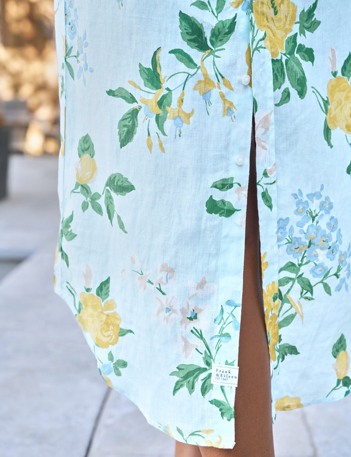 Light blue dress with floral pattern worn by a person outdoors