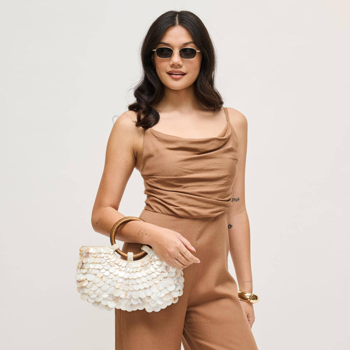 Front view of the Scarlett Evening Bag with iridescent shell disc embellishments, polished wood ring handles, and a removable gold-tone chain shoulder strap.