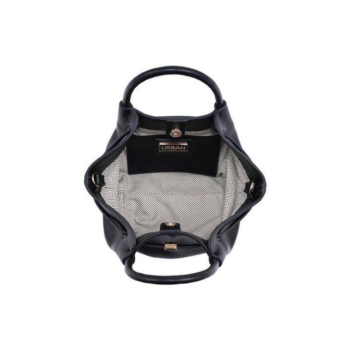 Interior of the Selena Crossbody featuring a herringbone fabric lining, spacious main compartment, interior slip pocket, and magnetic snap closure.