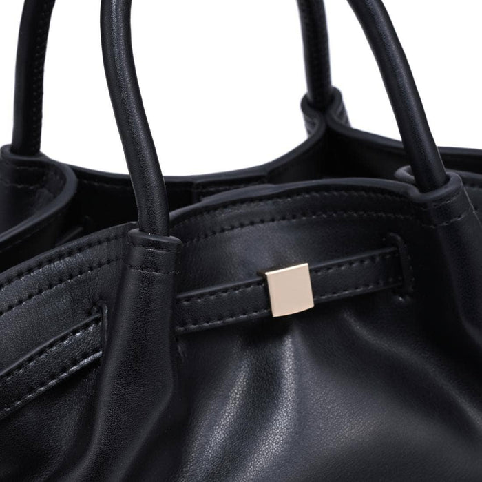 Close-up of the Selena Crossbody highlighting the soft gathered vegan leather, rolled top handles, refined stitching, and polished gold-tone hardware.