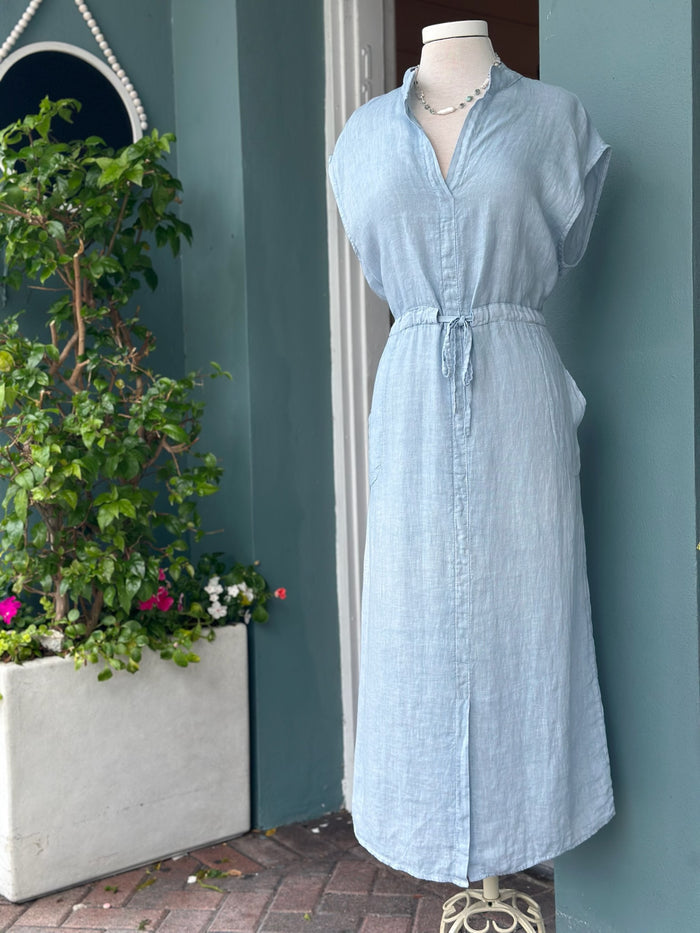 Sky blue linen midi dress with a split neckline, cap sleeves, adjustable drawstring waist, side pockets, and a relaxed silhouette, Made in Italy.