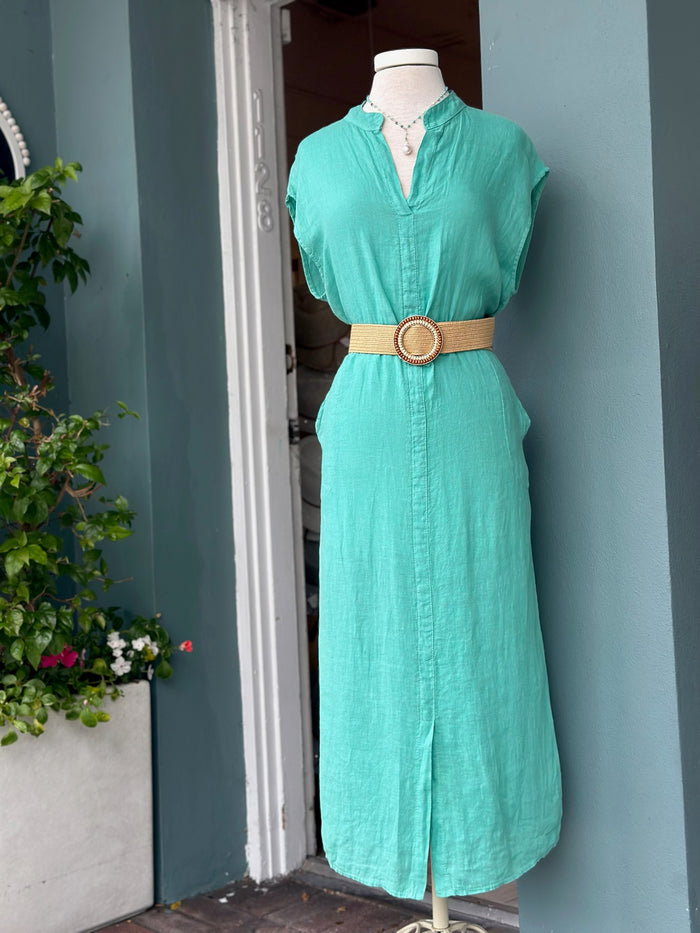 Sharon Dress in turquoise teal linen styled with a woven belt, featuring a split neckline, cap sleeves, midi length, and breathable crinkle texture.