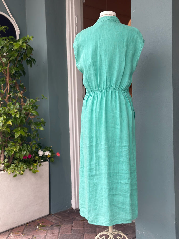 Back view of a turquoise teal linen midi dress with cap sleeves, elasticized waist detail, and a relaxed, breathable silhouette.
