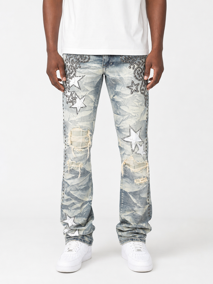 Blue Smoke Rise Studded R&R Stacked denim jeans with distressed details and studded accents on a model.