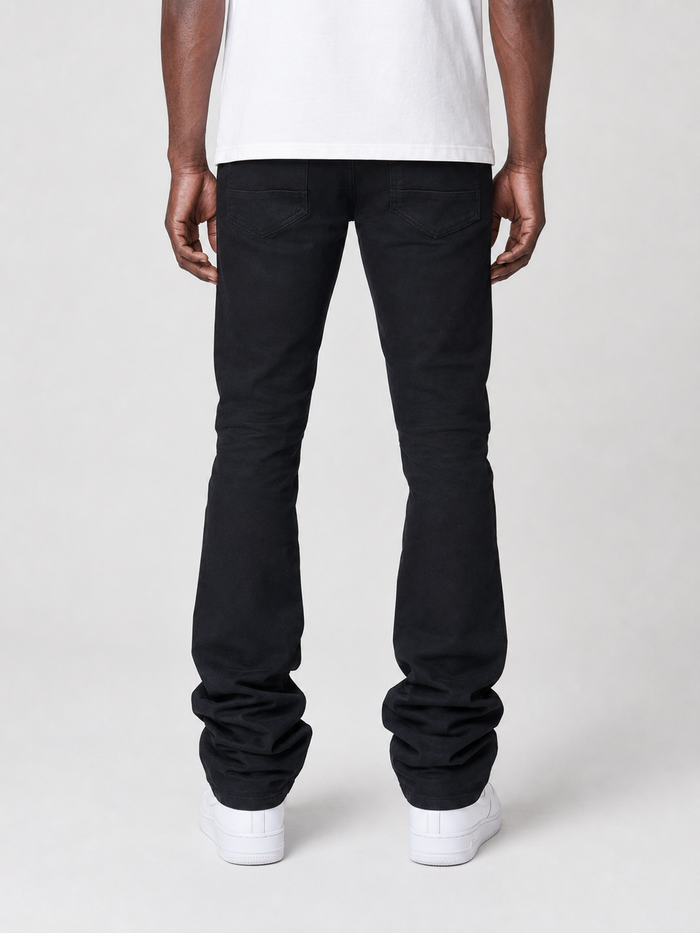 Smoke Rise vintage wash clean stacked flare denim in jet black, showing the high-waisted fit and stylish flare silhouette.