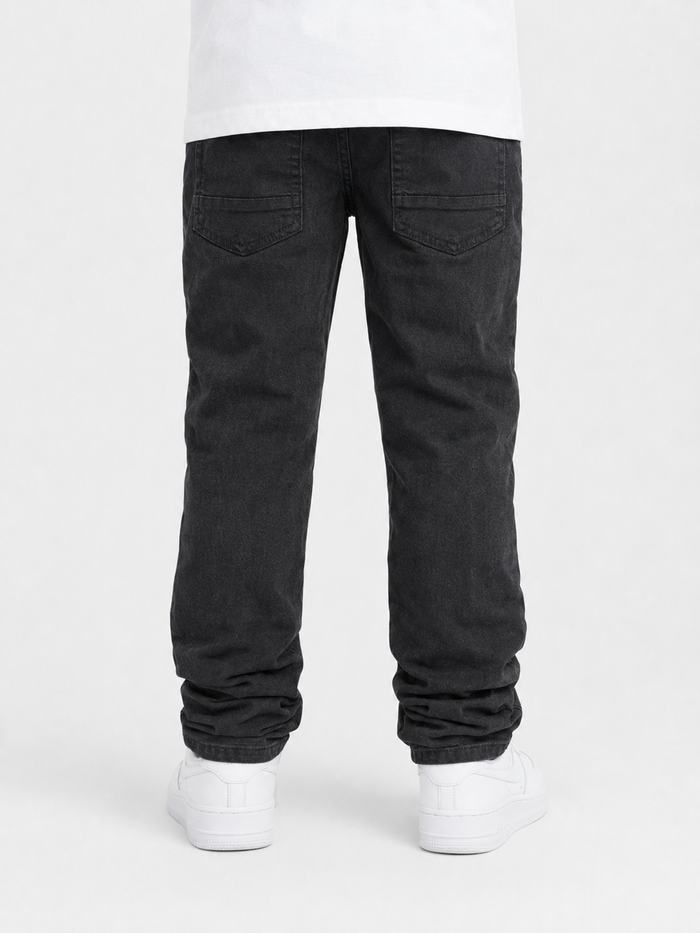 Spark Kids Rip & Repair Stack Denim in Jet Black, stylish kids' denim jeans with rip details and repair accents.