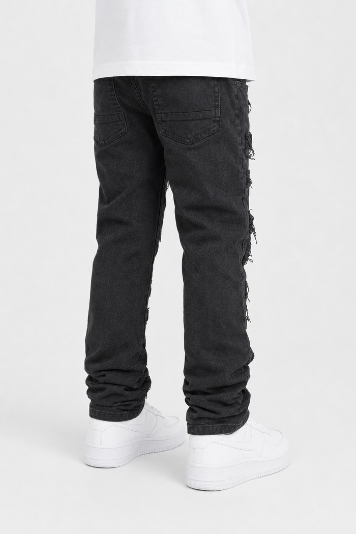 Kids denim jeans by Spark with rip and repair details in jet black, designed for a stylish and durable look.