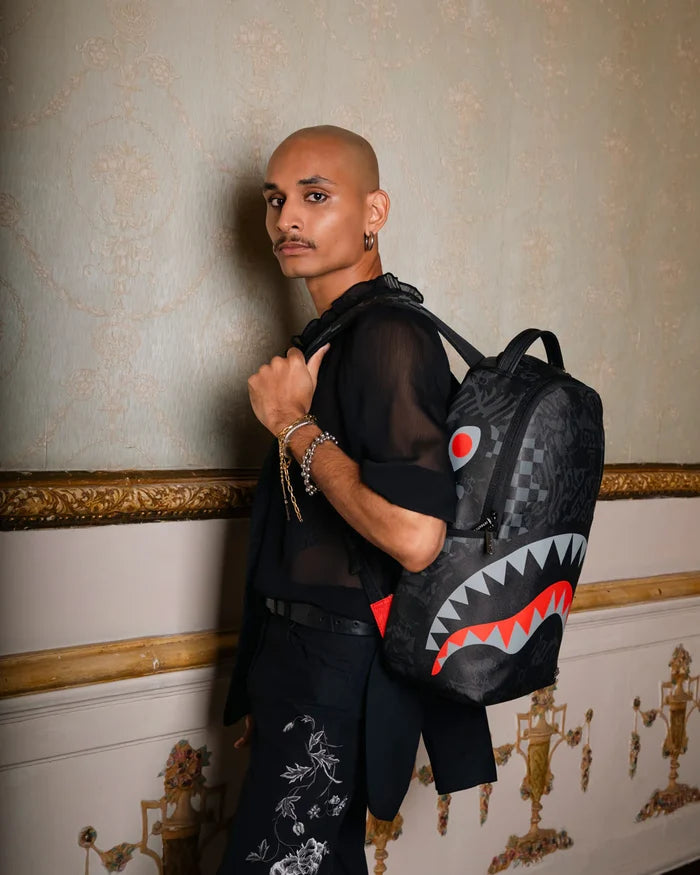 Sprayground 4AM Eclipse backpack with bold graphic design, black accents, and adjustable straps, accessory for everyday use.