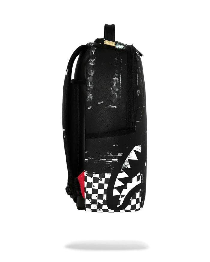 Sprayground Canvas Chaos backpack with bold black and white graffiti design, featuring multiple compartments and adjustable straps.