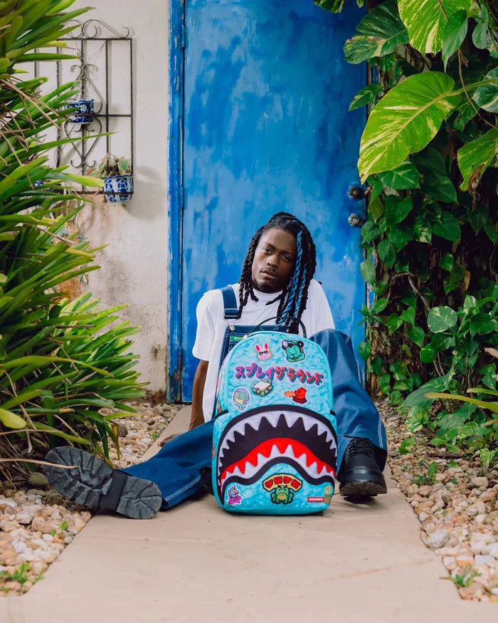 Sprayground Lucky Pack backpack with colorful graphic design, adjustable straps, and multiple compartments for accessories.