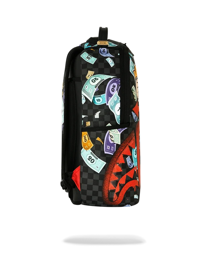 Sprayground Monopoly Time To Go backpack with colorful cartoon Monopoly-themed design and adjustable straps.