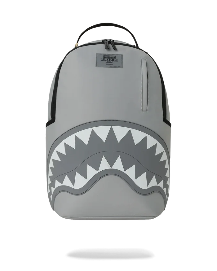 Sprayground Shark Central Passport 2.0 Haze backpack with shark graphic, multiple compartments, and adjustable straps.