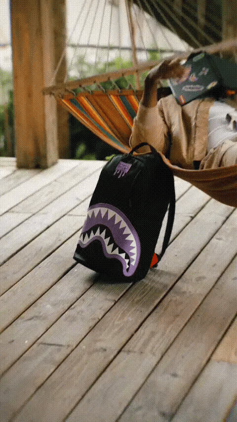 Light purple Sprayground Shark Central Passport backpack with shark graphic, showcasing its stylish accessories design.