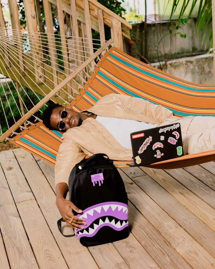 Sprayground Shark Central Passport backpack featuring a shark design, durable accessories with adjustable straps and multiple compartments.