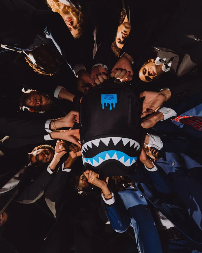 Sprayground Shark Central Passport Blue backpack featuring a shark graphic, durable straps, and spacious main compartment.