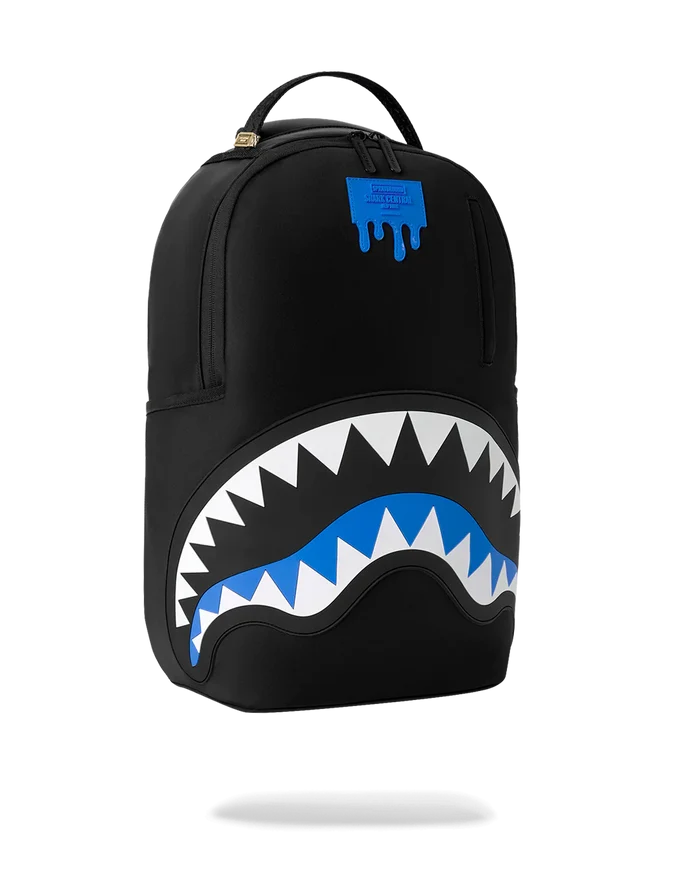 Sprayground Shark Central Passport Blue backpack with shark graphic, adjustable straps, and spacious main compartment.