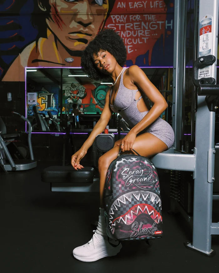 Sprayground Spray Session backpack with bold graphic design, black straps, and multiple compartments, stylish accessory for everyday use.