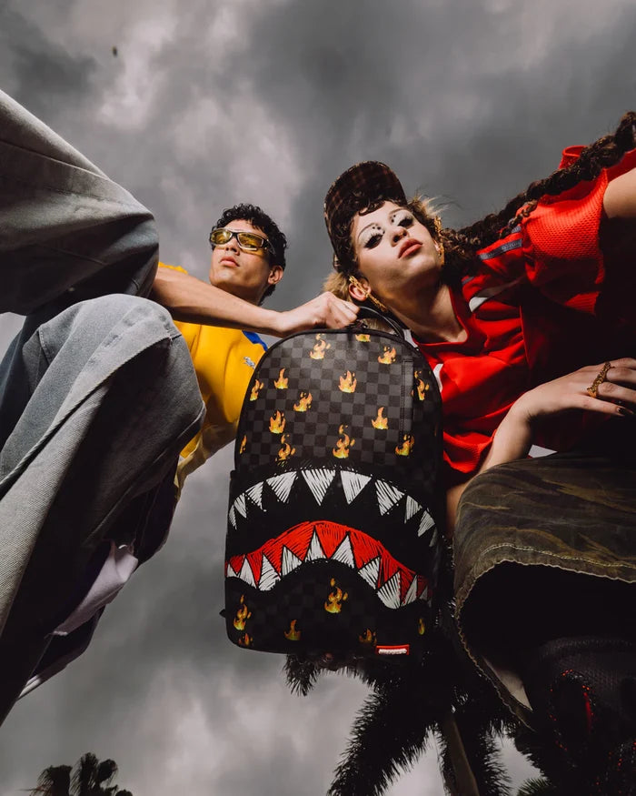 Sprayground 'Super Hot Fire Sharks in Paris' backpack featuring vibrant shark and cityscape design, with adjustable straps and multiple compartments.